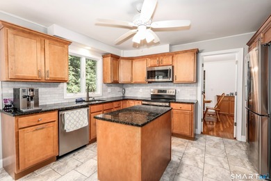 Nestled on a private, beautifully landscaped lot in the highly - photo 3