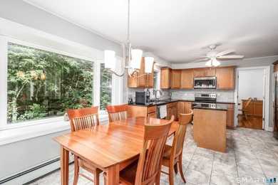 Nestled on a private, beautifully landscaped lot in the highly - photo 5