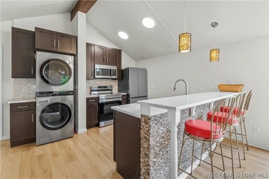 Experience the ultimate Lake of the Ozarks lifestyle in this - photo 8