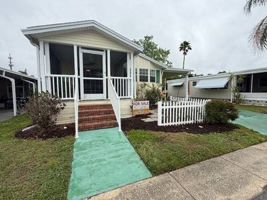 Welcome to Lake Haven in delightful Dunedin, Florida, where this - photo 2