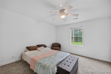 Escape to Lake of the Ozarks in this peaceful country setting - photo 24