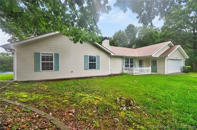 Escape to Lake of the Ozarks in this peaceful country setting - photo 36