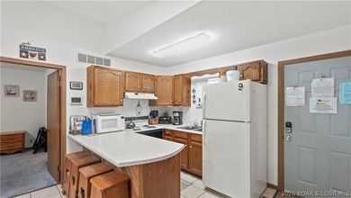 Discover peaceful lakefront living in this charming home tucked - photo 5