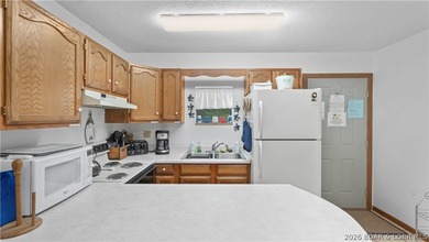 Discover peaceful lakefront living in this charming home tucked - photo 6