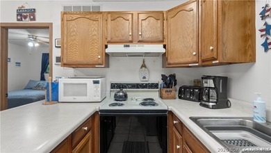 Discover peaceful lakefront living in this charming home tucked - photo 7