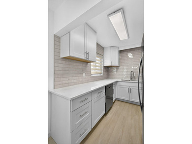 Stunning fully renovated corner-unit condo in a premier 55+ - photo 16