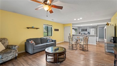 Welcome home to the Osage Vista's community. This top floor unit - photo 3