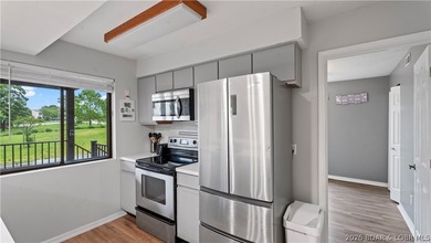 Welcome home to the Osage Vista's community. This top floor unit - photo 10