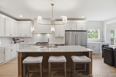 Experience elevated lake living in this new construction villa - photo 3