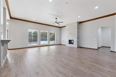 Located in a quiet cul-de-sac within a gated community, this