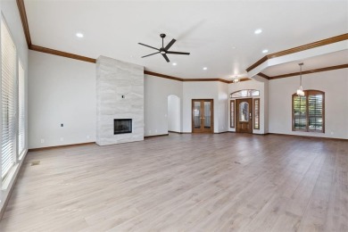 Located in a quiet cul-de-sac within a gated community, this