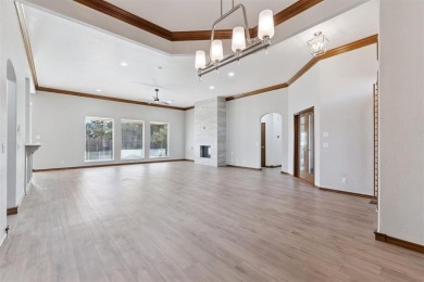 Located in a quiet cul-de-sac within a gated community, this