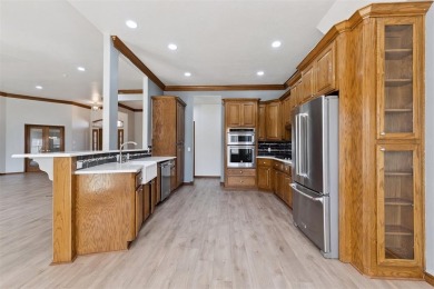 Located in a quiet cul-de-sac within a gated community, this