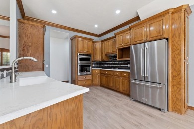 Located in a quiet cul-de-sac within a gated community, this