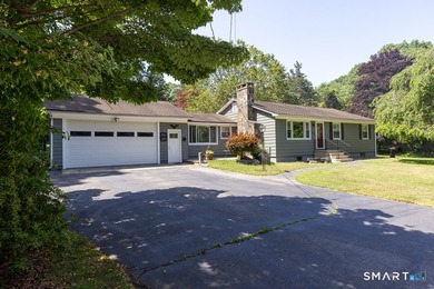 Nestled on more than 1.4 private acres, this sprawling ranch - photo 1