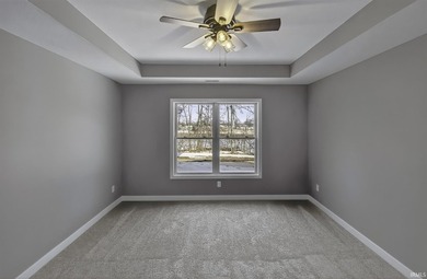 This new construction, ranch home, sits on a pond lot in the new - photo 14