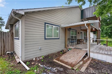 Charming 3-bedroom, 2-bath home located near the Lake of the - photo 2