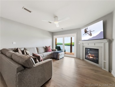 Turnkey luxury and breathtaking lakefront views await in this - photo 2