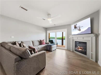 Turnkey luxury and breathtaking lakefront views await in this - photo 2