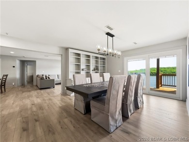Turnkey luxury and breathtaking lakefront views await in this - photo 3