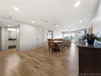 Turnkey luxury and breathtaking lakefront views await in this - photo 6