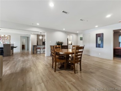 Turnkey luxury and breathtaking lakefront views await in this - photo 7