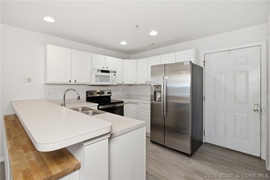 Enjoy the Lake of the Ozarks lifestyle in this beautifully - photo 2