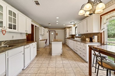 Tucked away on 10.08 beautiful acres, this 4 bedroom, 2 bath - photo 9