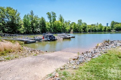 Lake access community featuring a boat ramp, boat dock, boat - photo 7