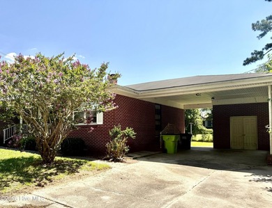 Well-priced brick home offers 3 bedrooms and a centrally located - photo 3