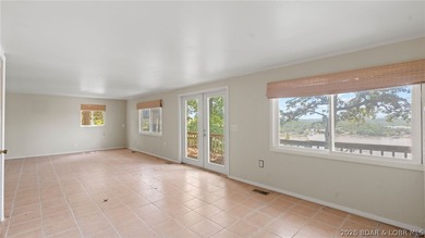 Fix-and-Flip Opportunity with Incredible Lakefront Views This - photo 2