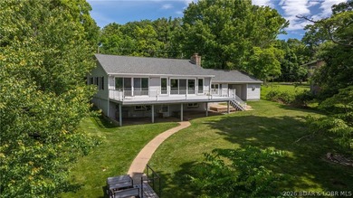 Lakefront living at its finest! This updated 4-bedroom, 3-bath - photo 1