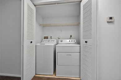 First-floor lakefront unit with screened patio in a gated - photo 16