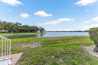First-floor lakefront unit with screened patio in a gated - photo 24