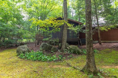 Tucked away on a sprawling corner lot of over 1/2 an acre in the - photo 21