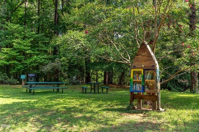 Tucked away on a sprawling corner lot of over 1/2 an acre in the - photo 23