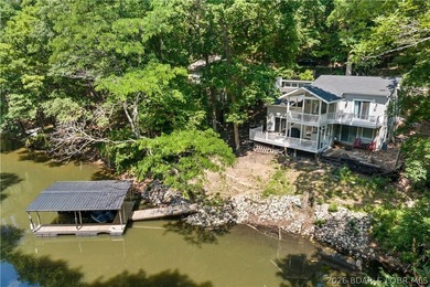 This stunning reverse 2-story lakefront home on MM 3 in Eldon - photo 1