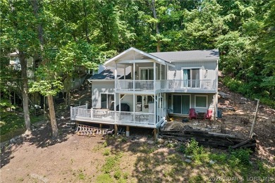 This stunning reverse 2-story lakefront home on MM 3 in Eldon - photo 2
