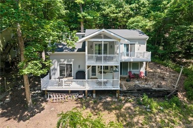This stunning reverse 2-story lakefront home on MM 3 in Eldon - photo 3