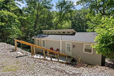 This stunning reverse 2-story lakefront home on MM 3 in Eldon - photo 4