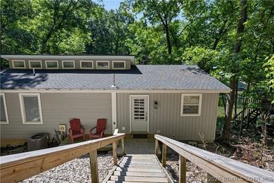 This stunning reverse 2-story lakefront home on MM 3 in Eldon - photo 5