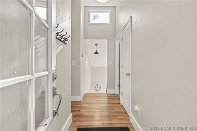This stunning reverse 2-story lakefront home on MM 3 in Eldon - photo 6