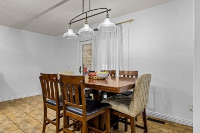 This gorgeous 3 bed, 2 bath, all-brick home with a three-car