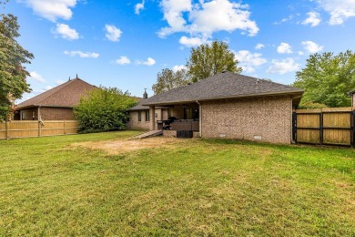 This gorgeous 3 bed, 2 bath, all-brick home with a three-car