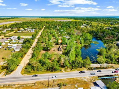 Tucked away on 2.7 acres along the beautiful shores of Gainer - photo 2