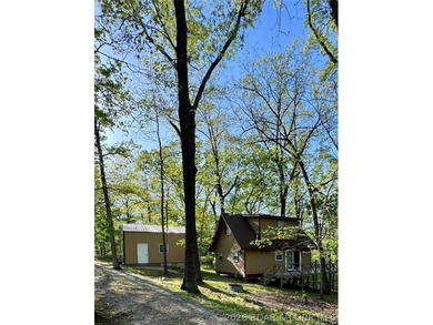 Experience the perfect lake retreat with this turn-key, fully - photo 1