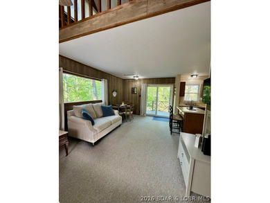 Experience the perfect lake retreat with this turn-key, fully - photo 2