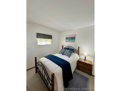 Experience the perfect lake retreat with this turn-key, fully - photo 3