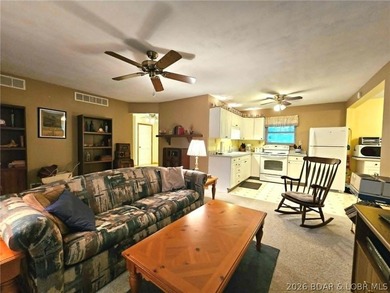 This 2-bedroom, 2-bath home offers lake access and is situated - photo 3
