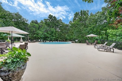 Surrounded by mature trees and natural Ozarks beauty, this - photo 9